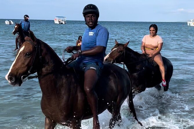ATV , Bamboo Rafting & Horseback Ride Tour From Montego Bay - ATV riding through mud and countryside