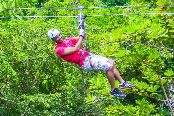 ATV, Horseback Ride, Zipline, Falls Climb + Lunch from Ocho Rios - Ziplining above Dunn’s River Falls