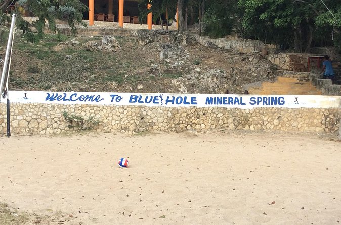 Blue Hole Mineral Springs, Rick's Café, and Shopping Combo Tour - Who should book this Negril combination tour?
