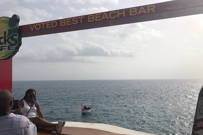 Blue Hole Mineral Springs, Rick's Café, and Shopping Combo Tour - Negril shopping stops for souvenirs and local flavor