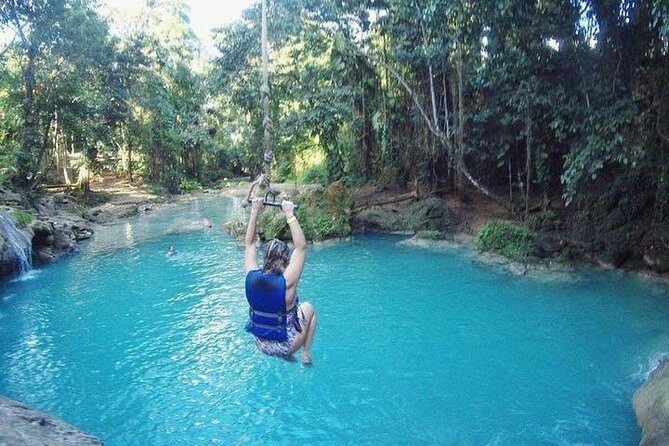 Blue Hole Secret Falls and River Tubing Tour - The value of private, air-conditioned transport
