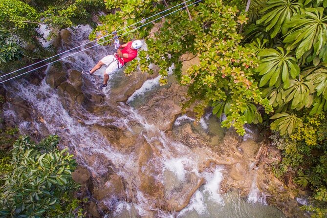 Dunns River Falls, Zipline, Bamboo Rafting, Horseback Ride Tour - Climbing Dunn’s River Falls near Ocho Rios