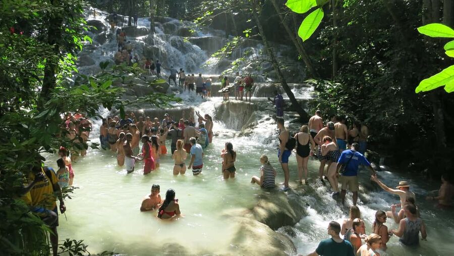 Falmouth: Dunn’s River Falls & Bamboo Beach Club VIP Access - Climbing Dunn’s River Falls by joining hands