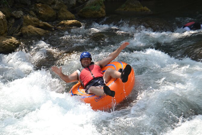 Falmouth Waterfalls River Tubing and Beach Adventure - Switching from tubes to a raft toward Bengal Bay
