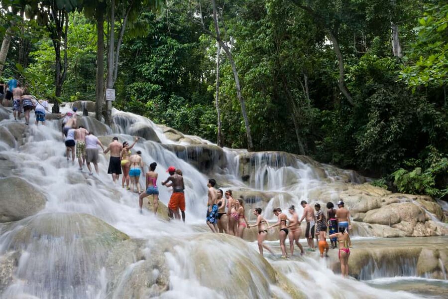 From Montego Bay: Dunn’s River Falls Experience - Climbing Dunn’s River Falls from the Caribbean