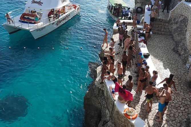 Full Day ATV, Ricks Café, Beach and Shopping Tour from Montego Bay - Rick’s Café: cliff jumping and a lively finish