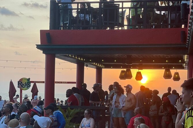 Jamaica Adventure: Bamboo Rafting, Negril Beach & Rick's Sunset - Sunset, food, and cliff jumping at Rick’s Cafe