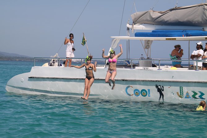 Jamaica Dunn's River Falls Party Cruise with Snorkeling - The catamaran turns a transfer into part of the trip