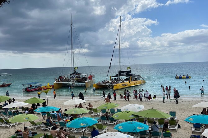 Negril Private Day Tour: ATV Ride, Party Catamaran & Ricks Cafe - Seven Mile Beach and the start of the boat trip