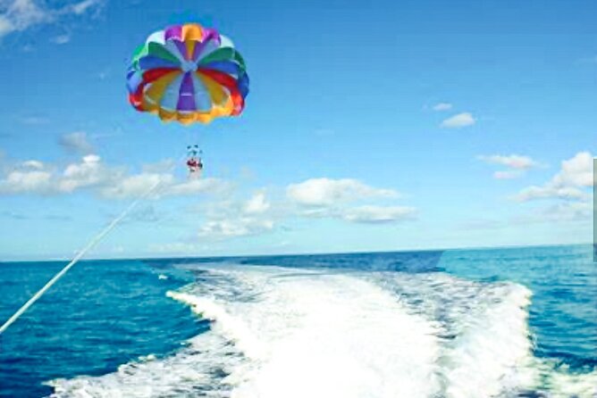 Parasailing above Turquoise Ocean Waters in Montego Bay - Who will get the most from this outing