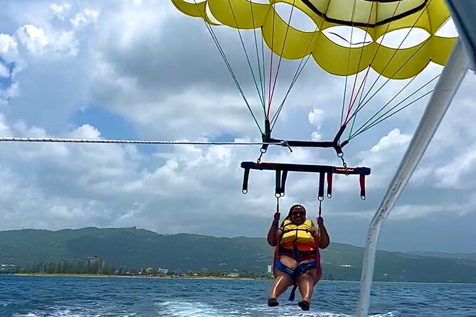 Parasailing Experience in Montego Bay - Getting ready with the guide and safety gear
