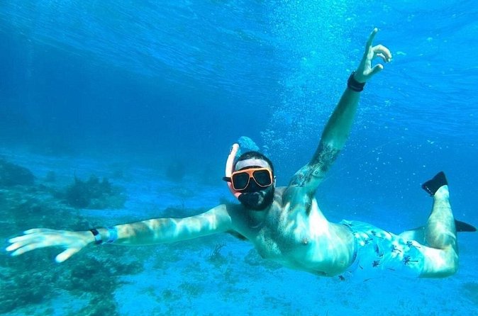 Party Catamaran Cruise with Open Bar and Snorkeling Montego Bay - The DJ, dancing, and Jamaican party style