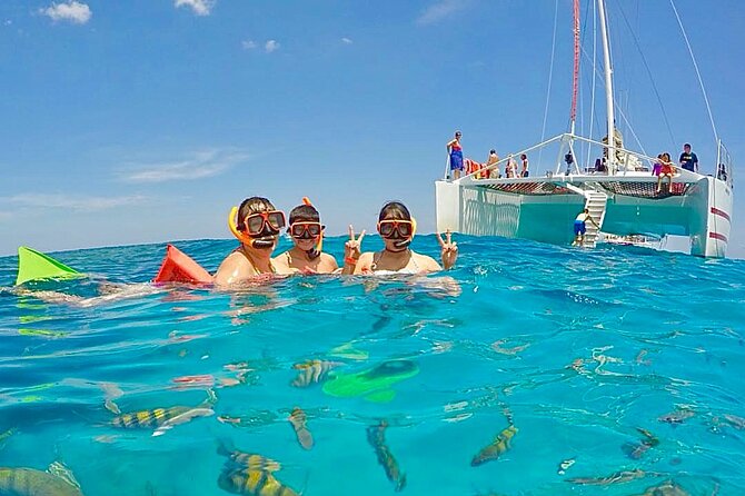 Party Catamaran Cruise with Open Bar and Snorkeling Montego Bay - Coastal views and a possible Margaritaville stop