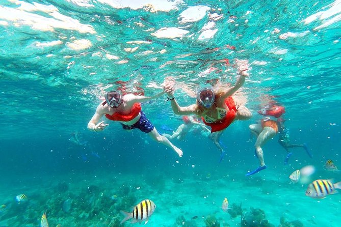 Party Catamaran: OpenBar, Music, Negril Beach, Caves, Snorkeling - Boarding the catamaran means getting wet