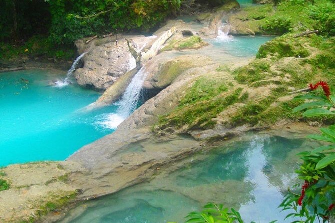 Private Tour to Dunns River and Blue Hole from Montego Bay - Climbing Dunn’s River Falls from the beach