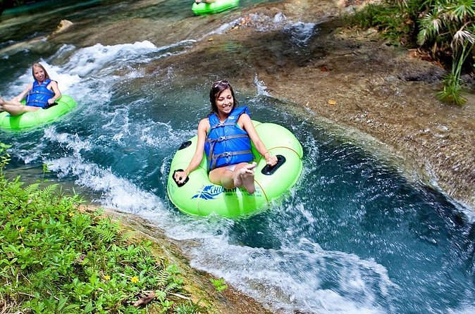 River Tubing with Private Transportation from Montego Bay - Bamboo shade, riverbed rest, and the rope swing